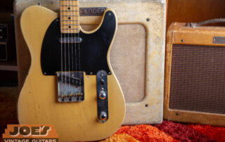 1952 Fender Telecaster body in Butterscotch Blonde finish featuring black phenolic pickguard and brass bridge saddles.