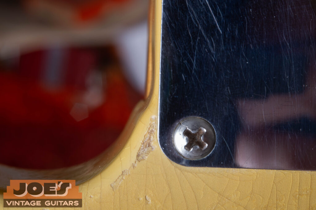 Close-up of a 1952 Fender Telecaster neck cutaway showing the authentic "router hump" in the wood.