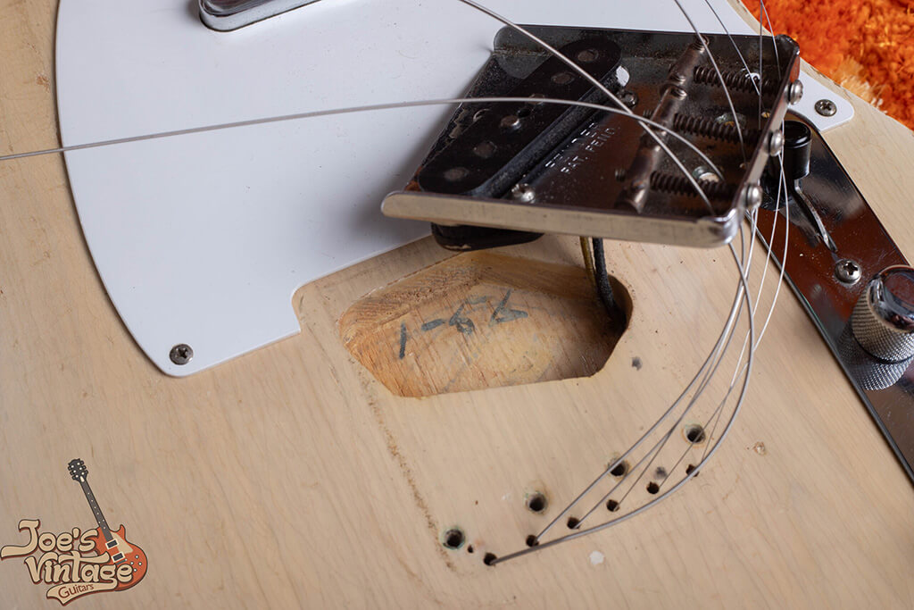 Fender guitar body neck pocket with visible ink stamp marking