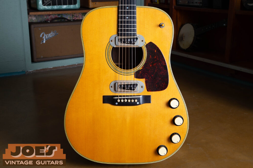 1959 Martin D-28E vintage acoustic-electric guitar frontal body shot featuring dual DeArmond pickups, Brazilian Rosewood, and gold hardware.