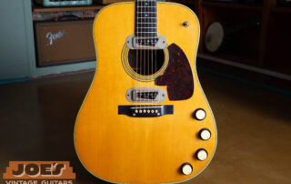 1959 Martin D-28E vintage acoustic-electric guitar frontal body shot featuring dual DeArmond pickups, Brazilian Rosewood, and gold hardware.