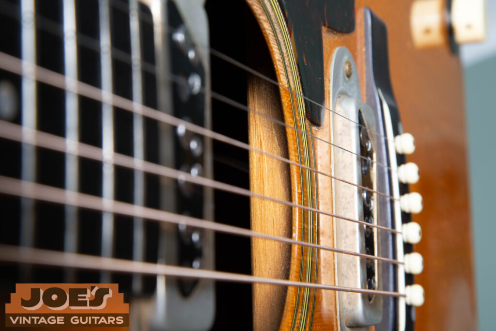 Interior view of a 1959 Martin D-28E showing the factory ladder bracing. The braces run straight across the width of the top, perpendicular to the grain, rather than meeting in the "V" or "X" pattern found on standard Martin dreadnoughts.