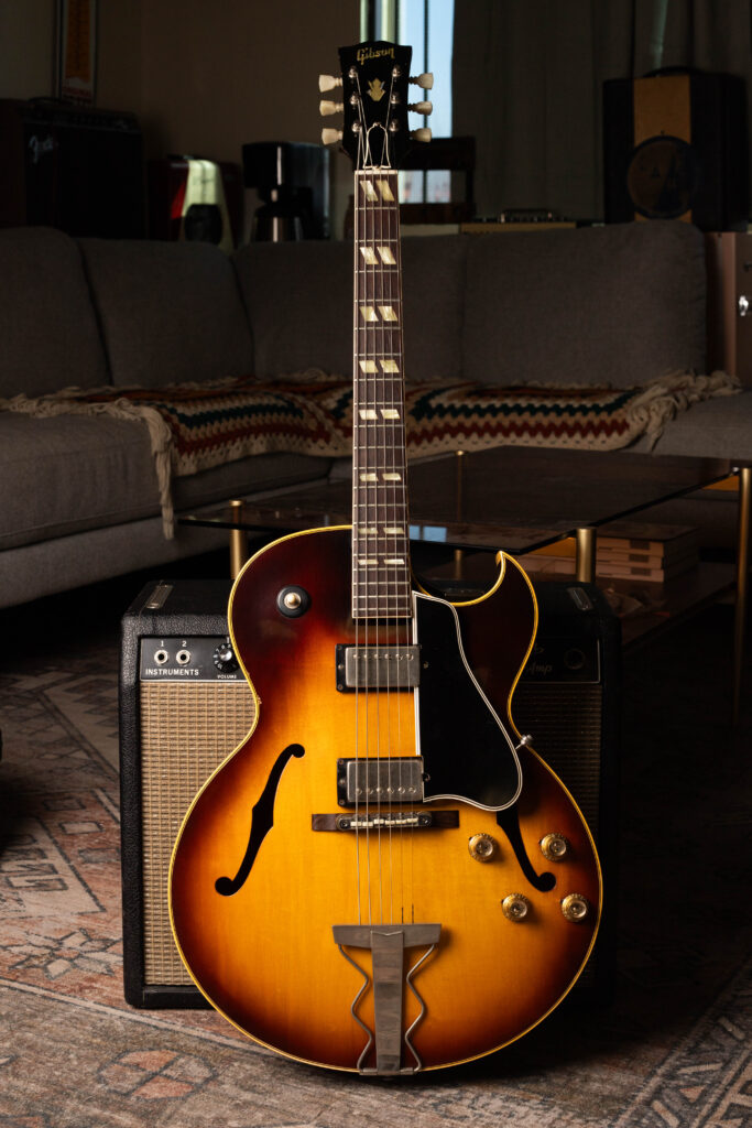 Full body view of a 1962 Gibson ES-175D hollow-body guitar in Sunburst finish, featuring two original PAF humbucking pickups, a Florentine cutaway, and a zig-zag trapeze tailpiece.