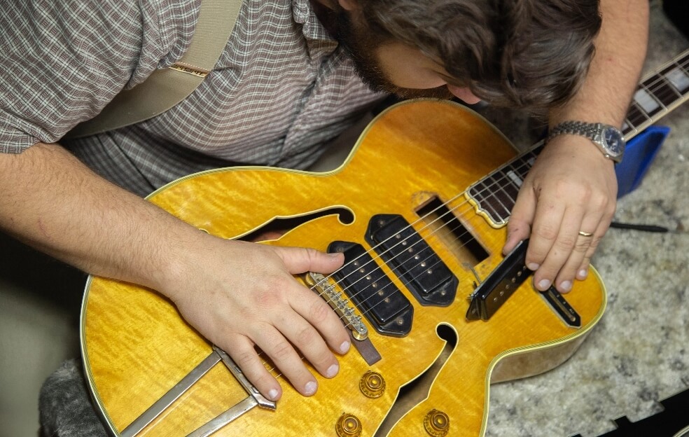 expert-appraisere-examining-a-1956-gibson-es-5 Joe Dampt Inspecting A Rare 1956 Gibson ES-5 With A Factory Error