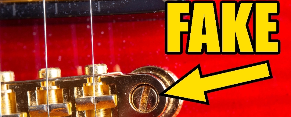 Fake Gibson Guitar Bridge With Chunky Bolts With A Flathead Screwdriver Slot On Top