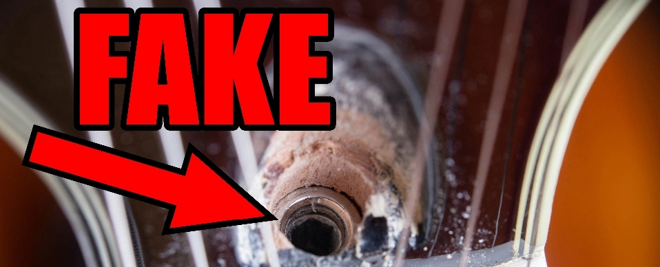 Identifying A Fake Gibson Guitar By A Hole Meant For A Hex Wrench