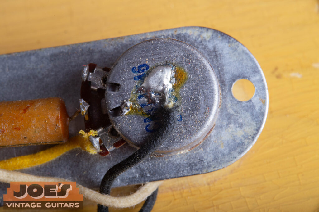 Original 1952 Fender Telecaster Clarostat potentiometer featuring the distinctive blue ink date code stamp.