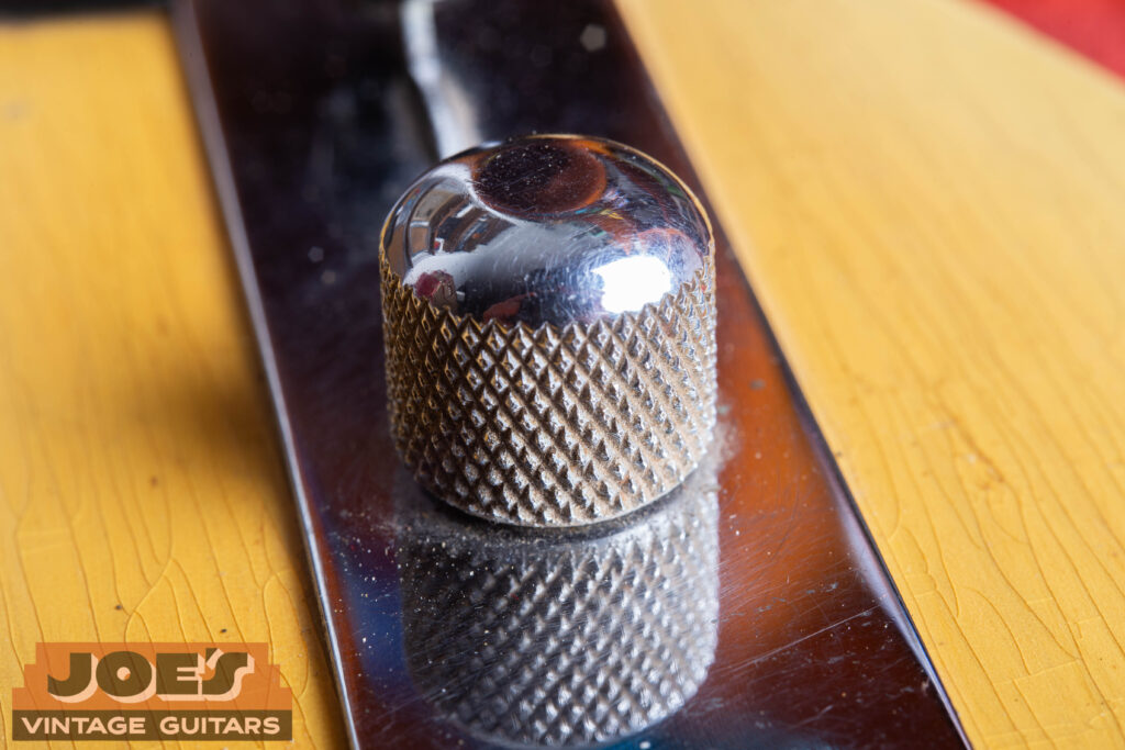 Close-up of a 1952 Fender Telecaster chrome control knob featuring a coarse knurled texture and a rounded dome-top profile.
