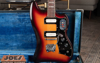 Detailed body shot of a vintage 1960s Guild Thunderbird S-200 electric guitar, showcasing its unique offset body shape, sunburst finish, and original dual-pickup configuration.