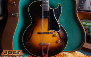 A vintage Gibson ES-175 hollow-body electric guitar in a classic Sunburst finish, showcasing the iconic Florentine cutaway and double-parallelogram fingerboard inlays.
