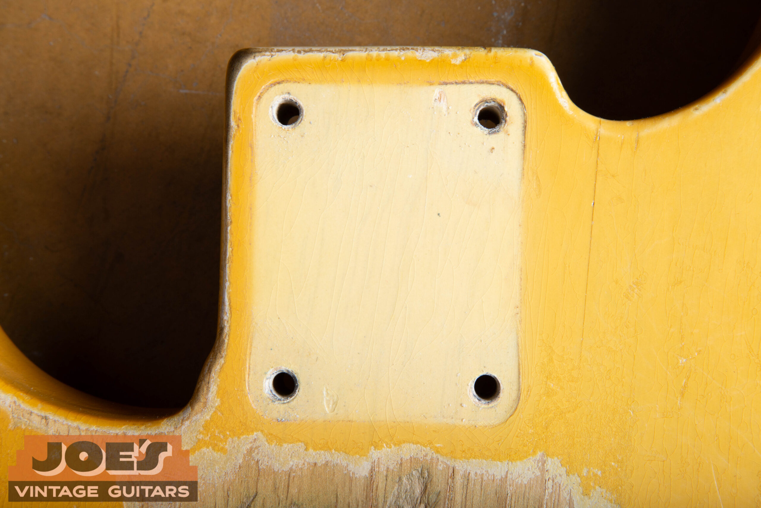 Tan line visible under the neck plate on a 1952 Fender Precision Bass