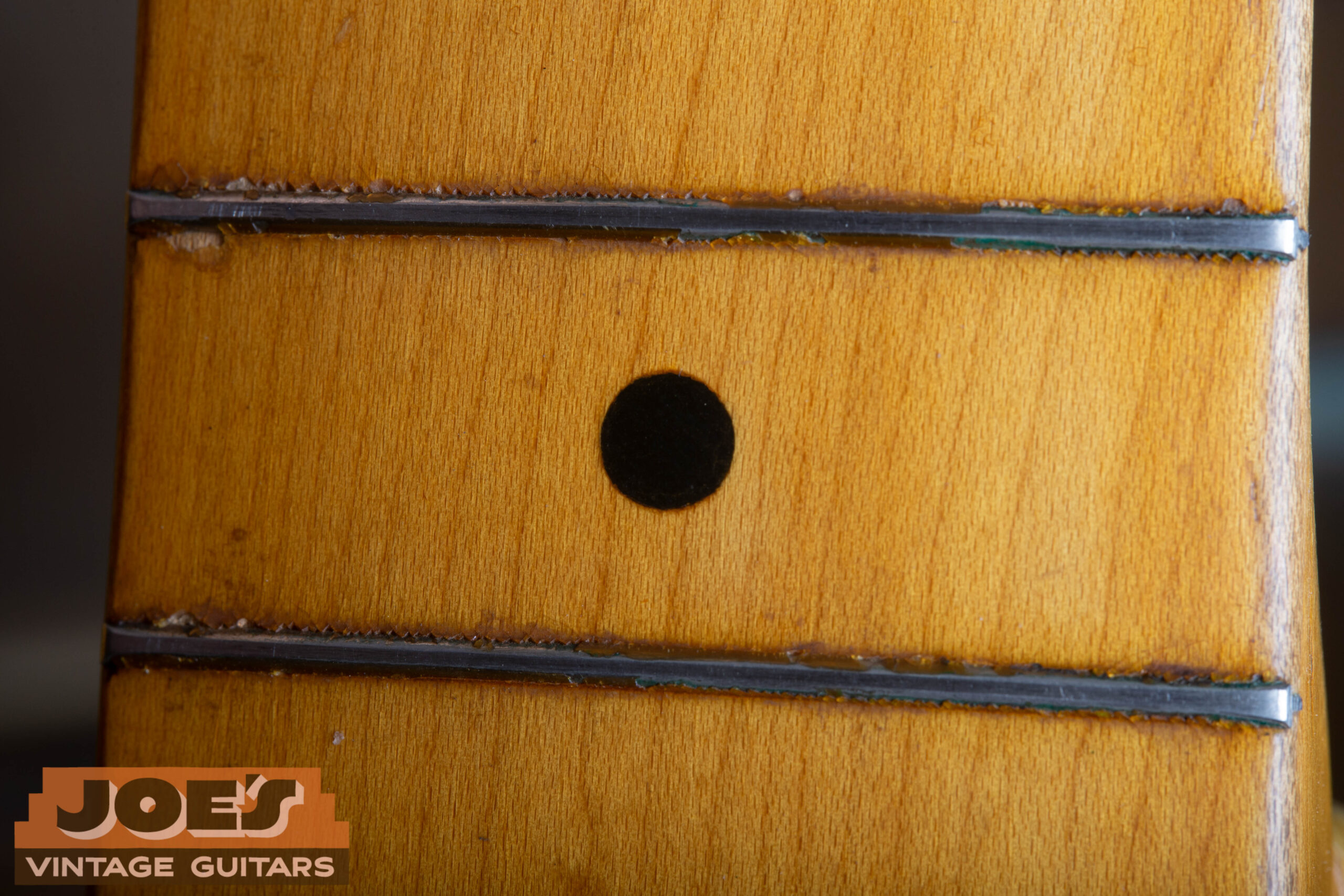 Black dot fret markers on a 1952 Fender Precision Bass maple neck