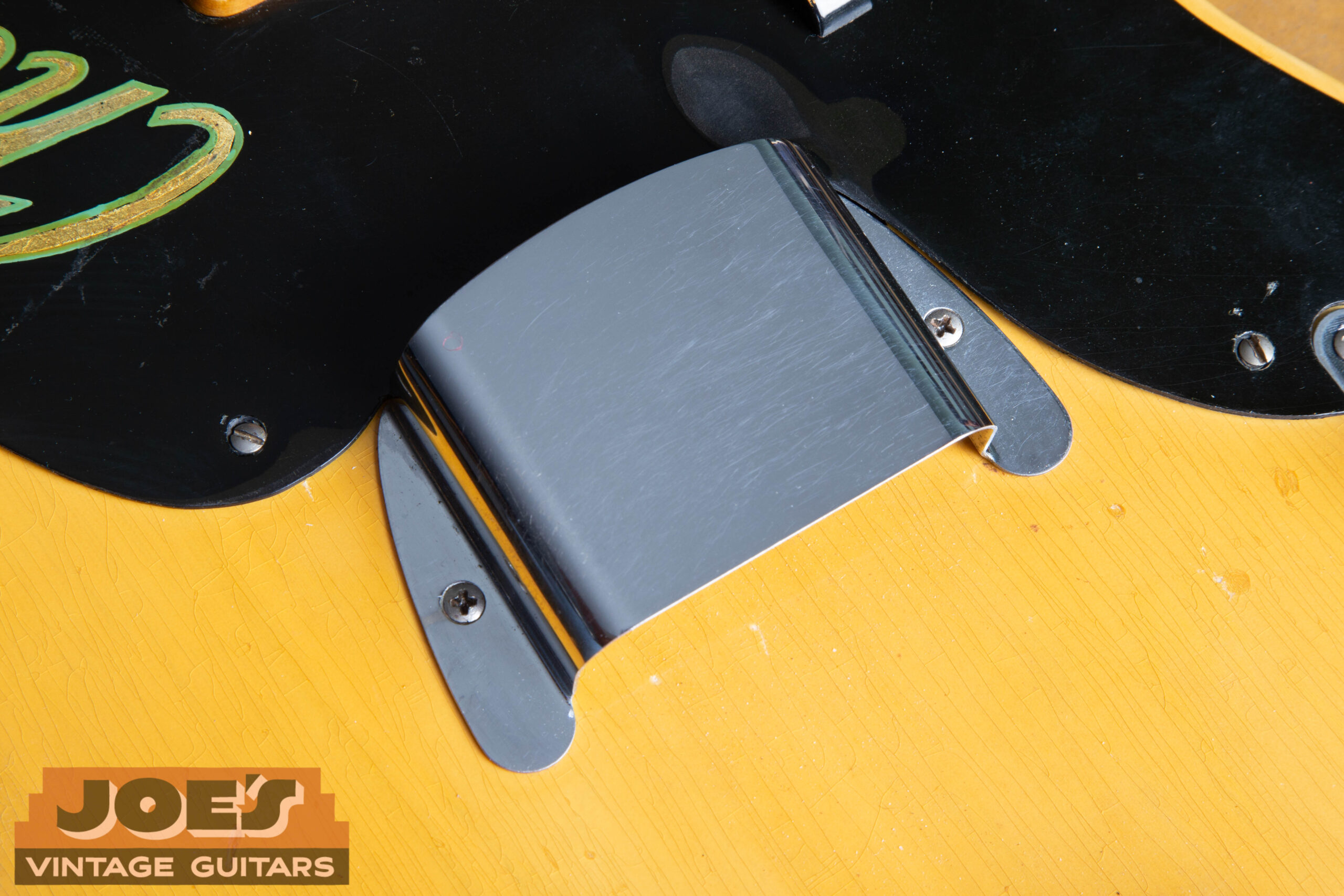 Pickup area on a 1953 Fender Precision Bass showing the exposed early-style single-coil pickup with no cover