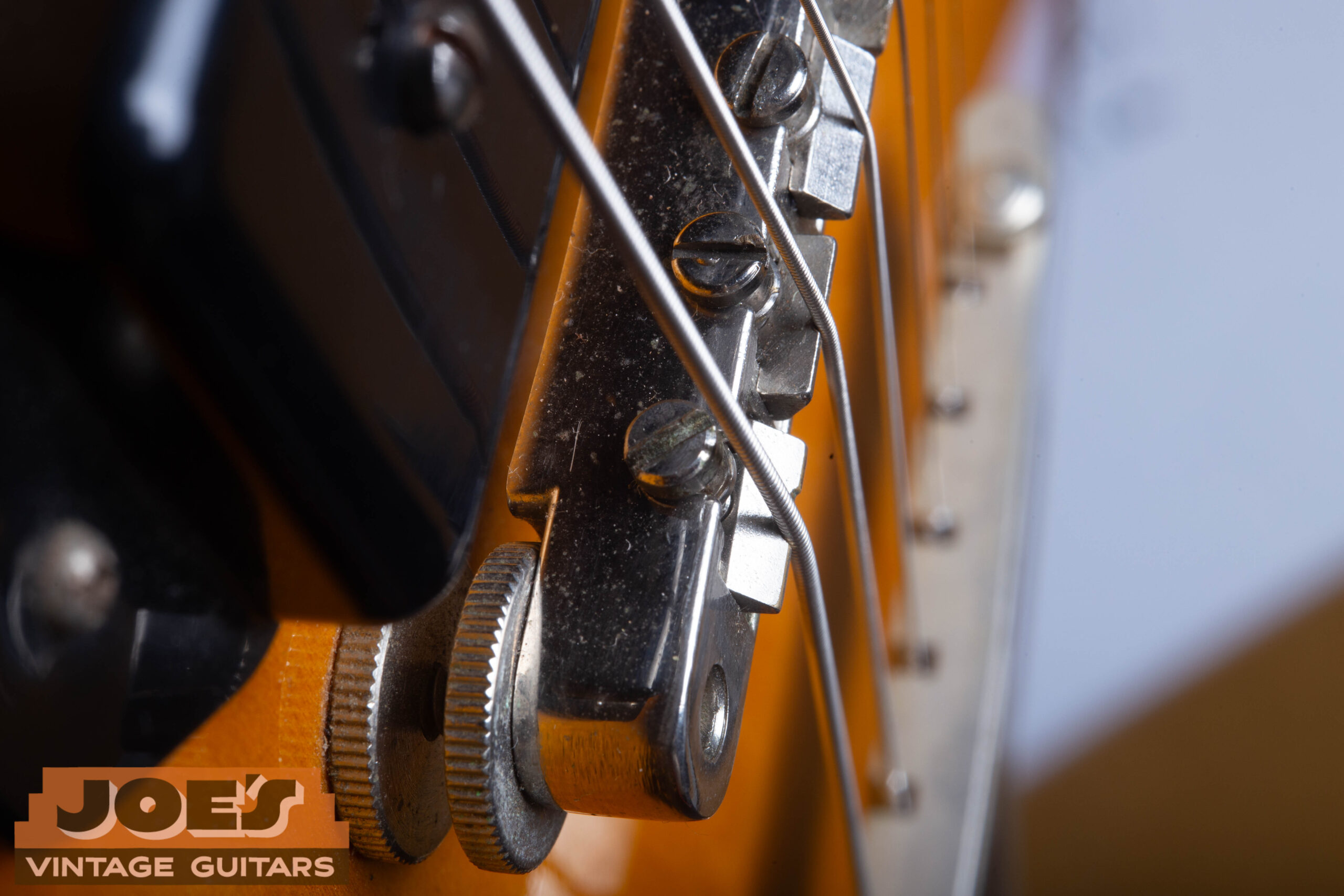 Macro of 1959 ABR-1 Tune-o-matic bridge on Gibson ES-330 — no retaining wire on the saddles