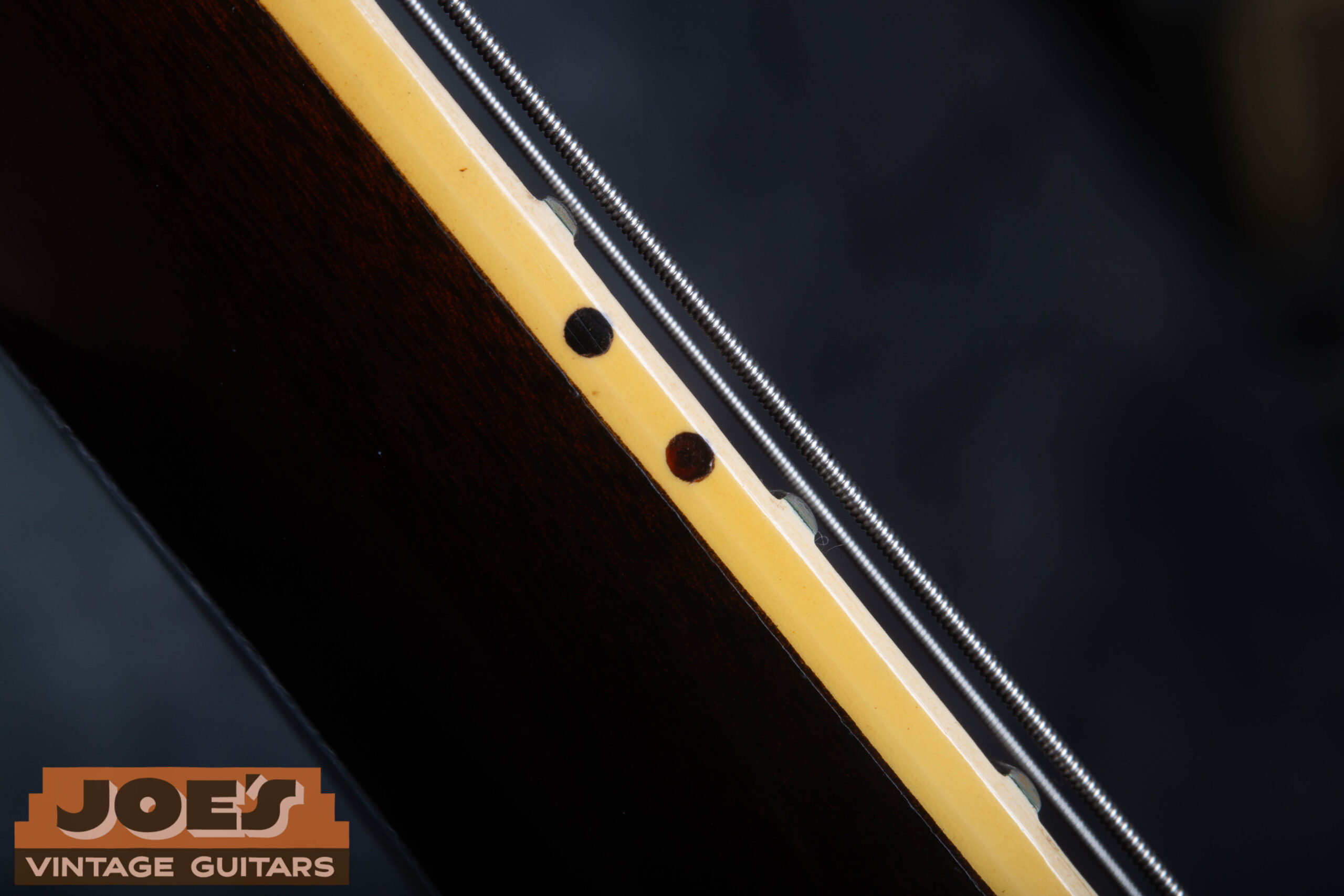 Side dot position markers on the upper edge of the fretboard of a 1959 Gibson ES-330