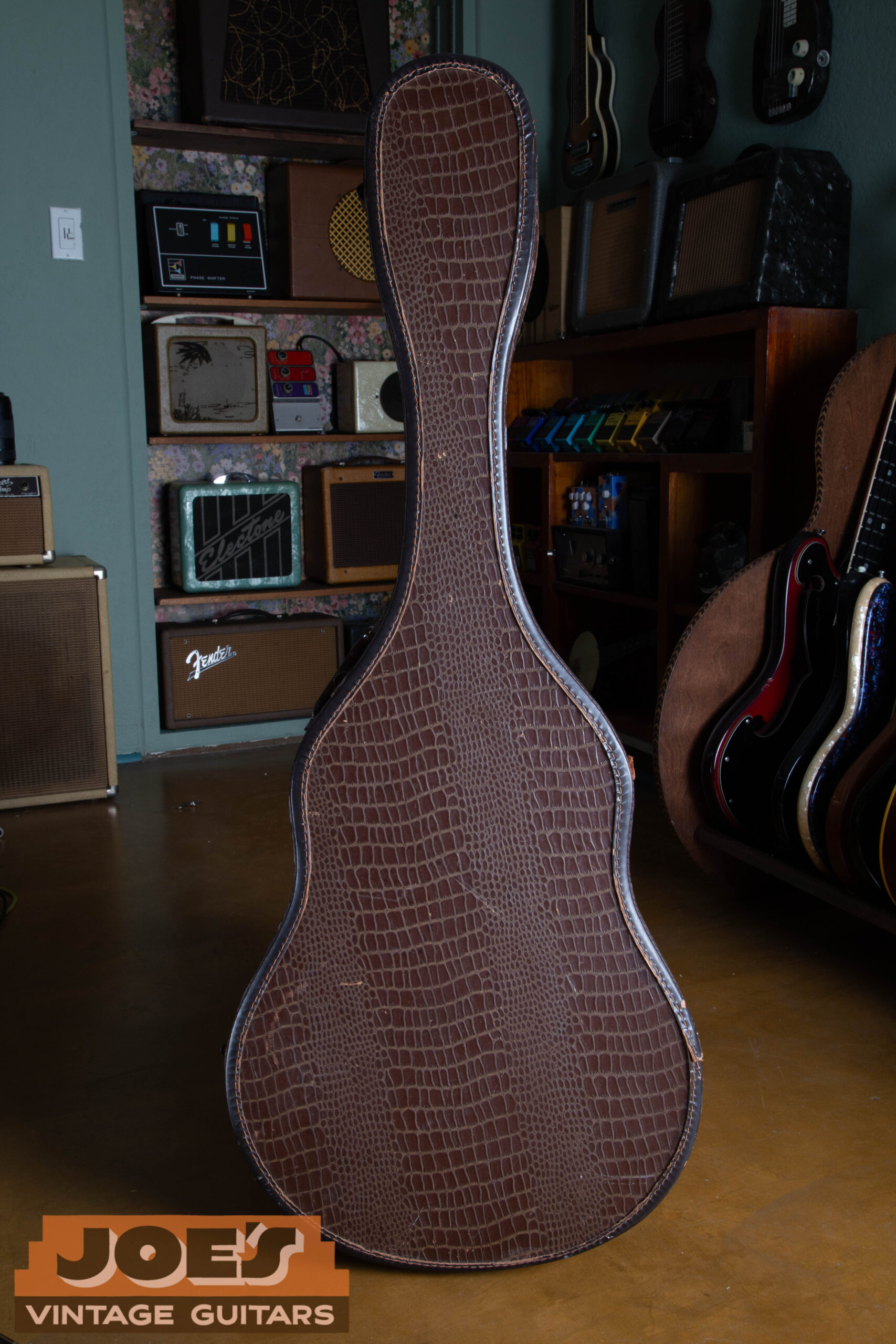 Original alligator-grain chipboard case for a 1959 Gibson ES-330 with pink/salmon crushed velvet interior