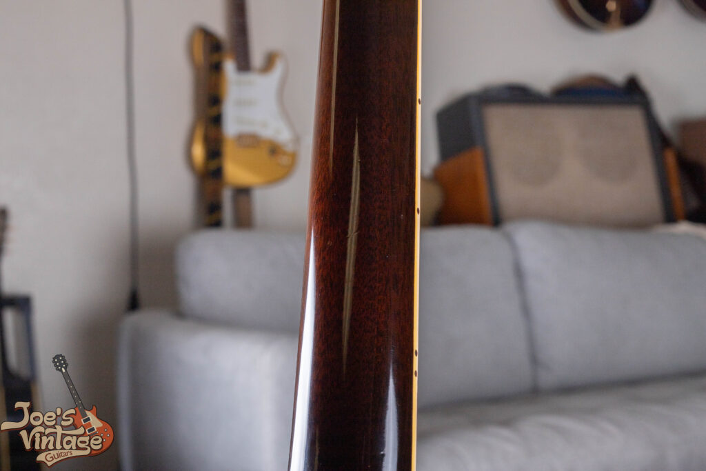 Original sunburst finish on the back of a 1959 Gibson ES-335 neck showing minimal play wear and period-correct nitrocellulose lacquer.