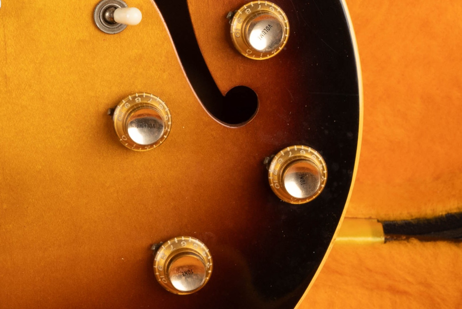 Gold reflector knobs on a 1960s Gibson ES-330 — the metallic insert in the dome top can be either gold or silver
