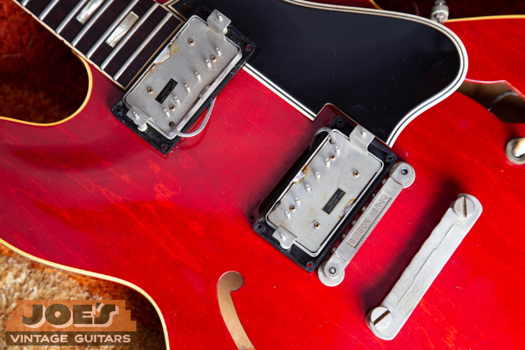 Close-up of a rare 1962 Gibson ES-335 pickup set featuring two original 'Patent Applied For' PAF humbuckers with intact decals, highlighting the 1962 transition from PAF to Patent Number pickups.
