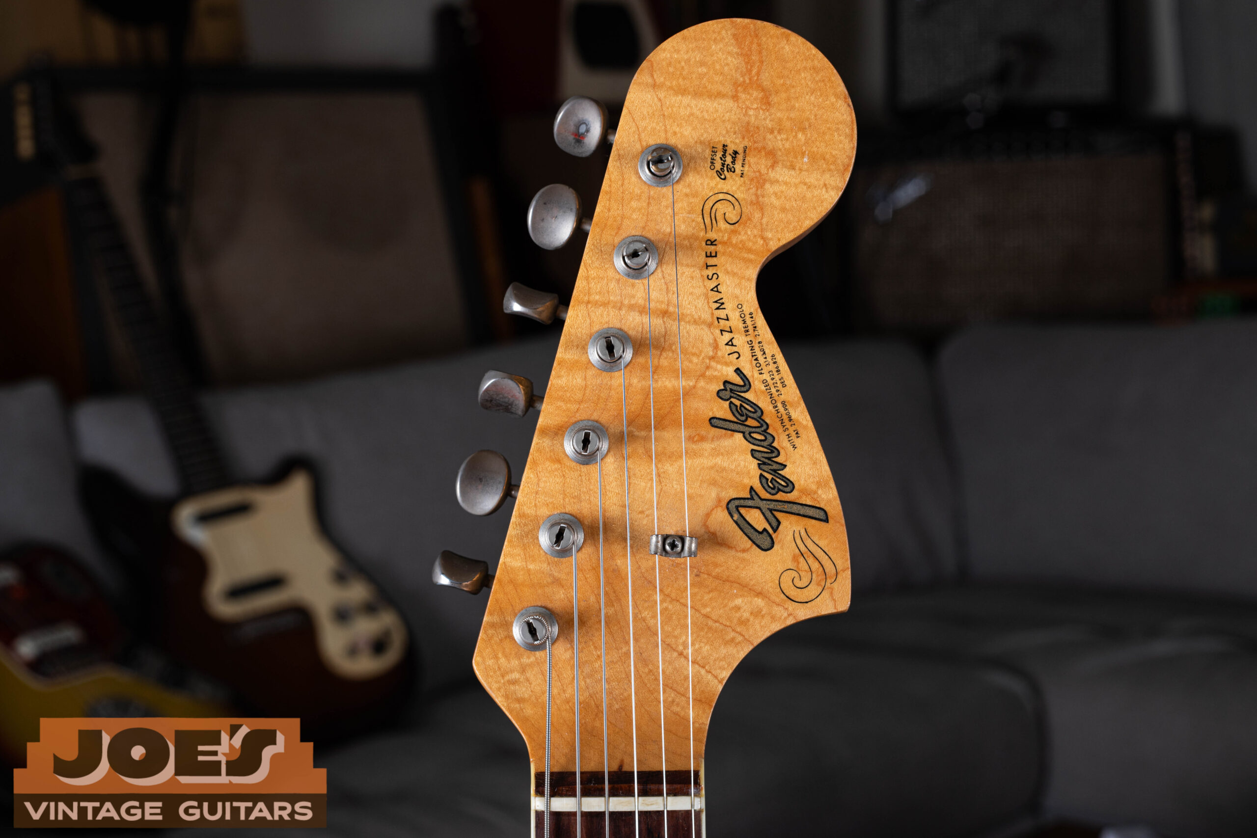 1966 Fender Jazzmaster headstock with transition logo — gold transition-era Fender script replacing spaghetti logo, F-tuners, CBS-era specification