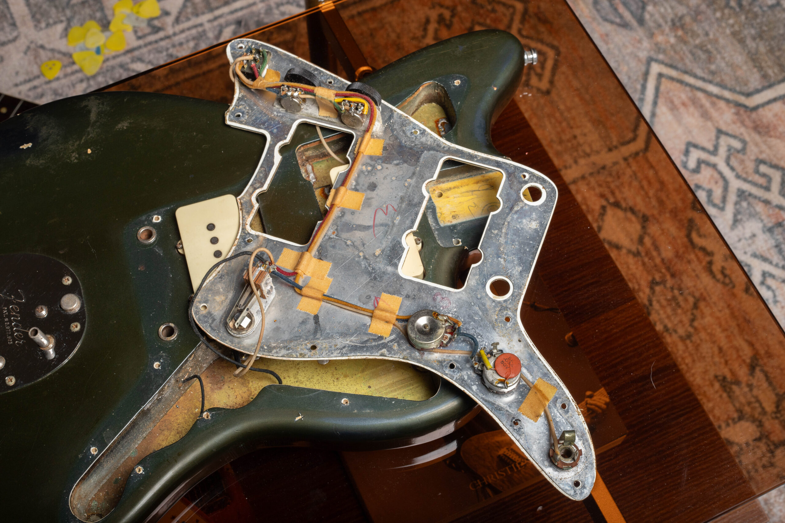 1966 Fender Jazzmaster wiring behind pickguard — dual circuit electronics showing aluminum shielding, lead circuit controls, and characteristic Jazzmaster wiring layout