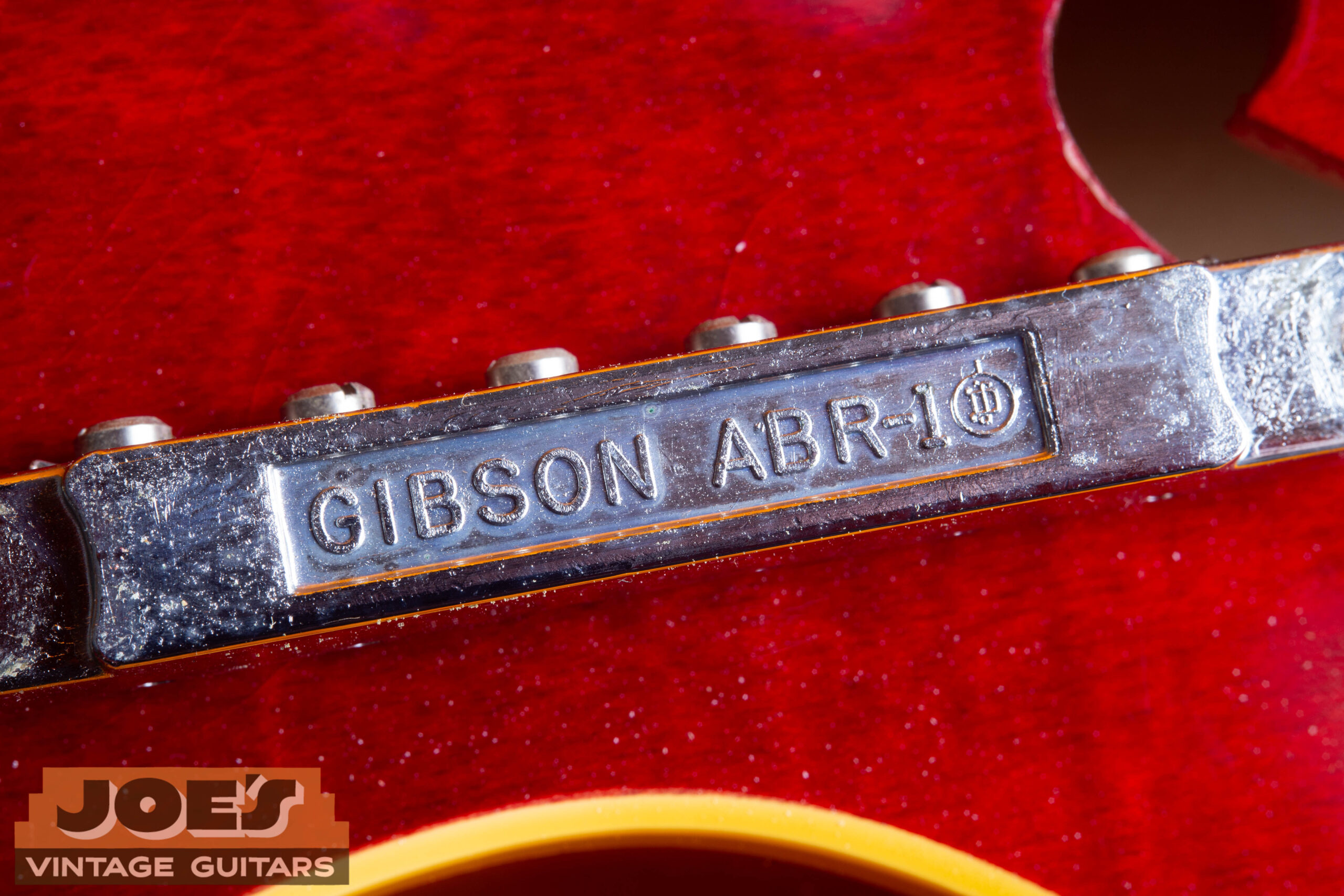 1966 Gibson ES-335 ABR-1 bridge back showing ABR-1 stamp — original Tune-o-matic bridge with period casting mark confirming correct bridge type