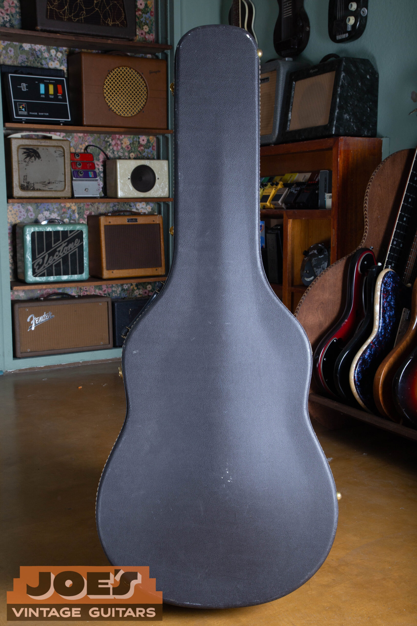 1966 Gibson ES-335 original black hardshell case exterior — correct mid-1960s black tolex case with Gibson badge, chrome latches and handle hardware