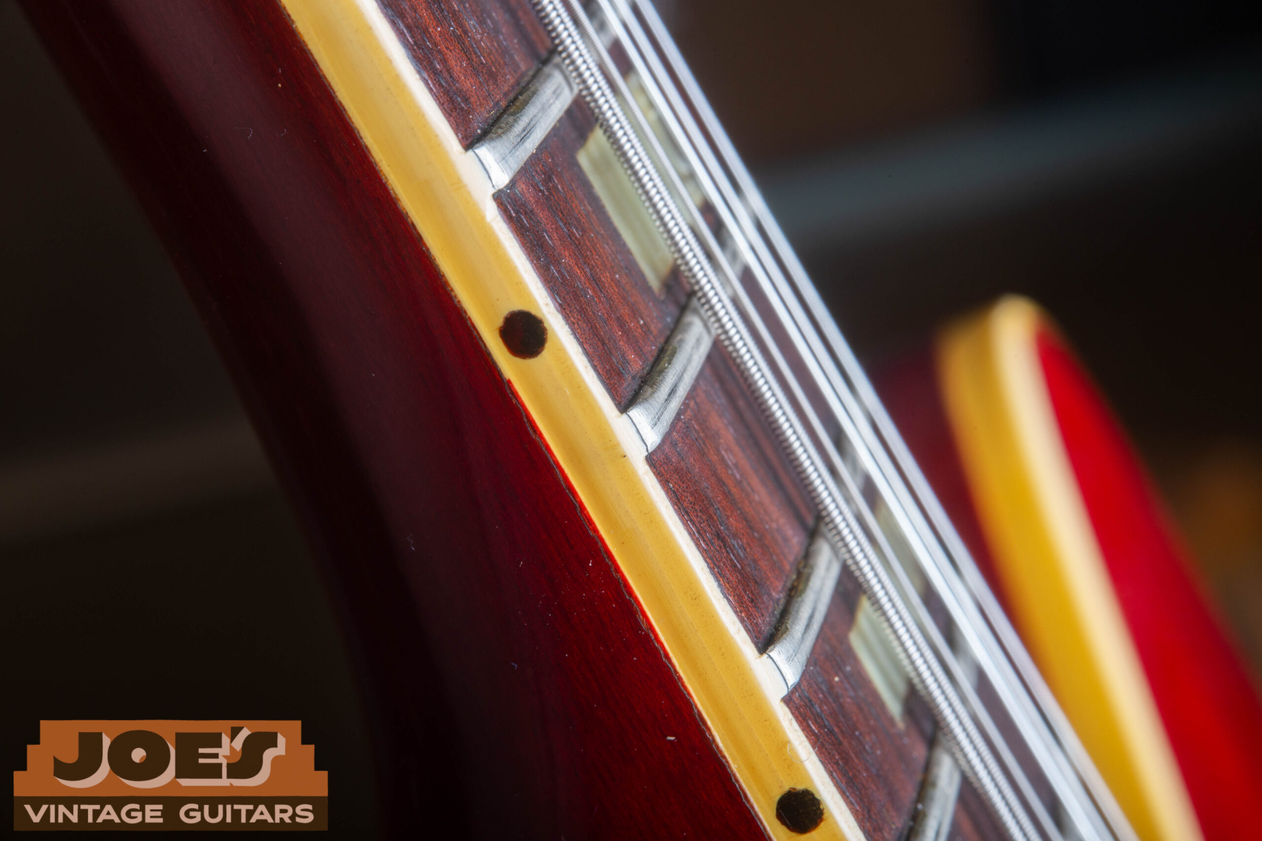 1966 Gibson ES-335 fret nibs close-up — binding material extending over fret ends confirming original unrefretted neck on pre-Norlin Kalamazoo instrument