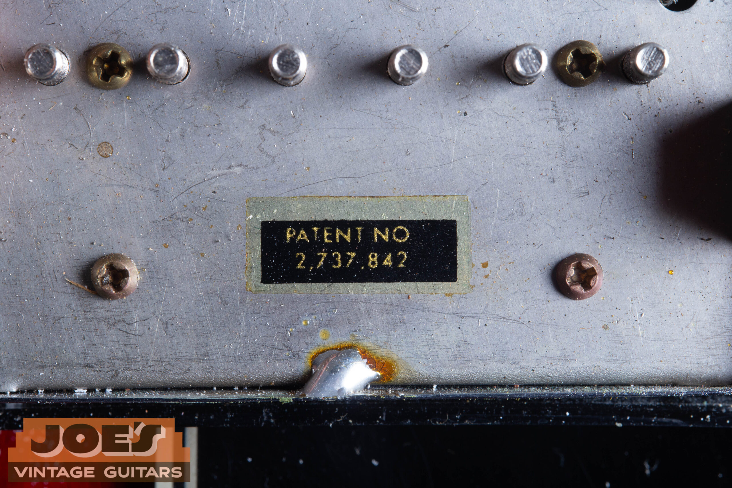 1966 Gibson ES-335 Patent Number humbucker base plate close-up showing Patent No 2737842 sticker — confirming pre-T-top Patent Number era pickup not PAF