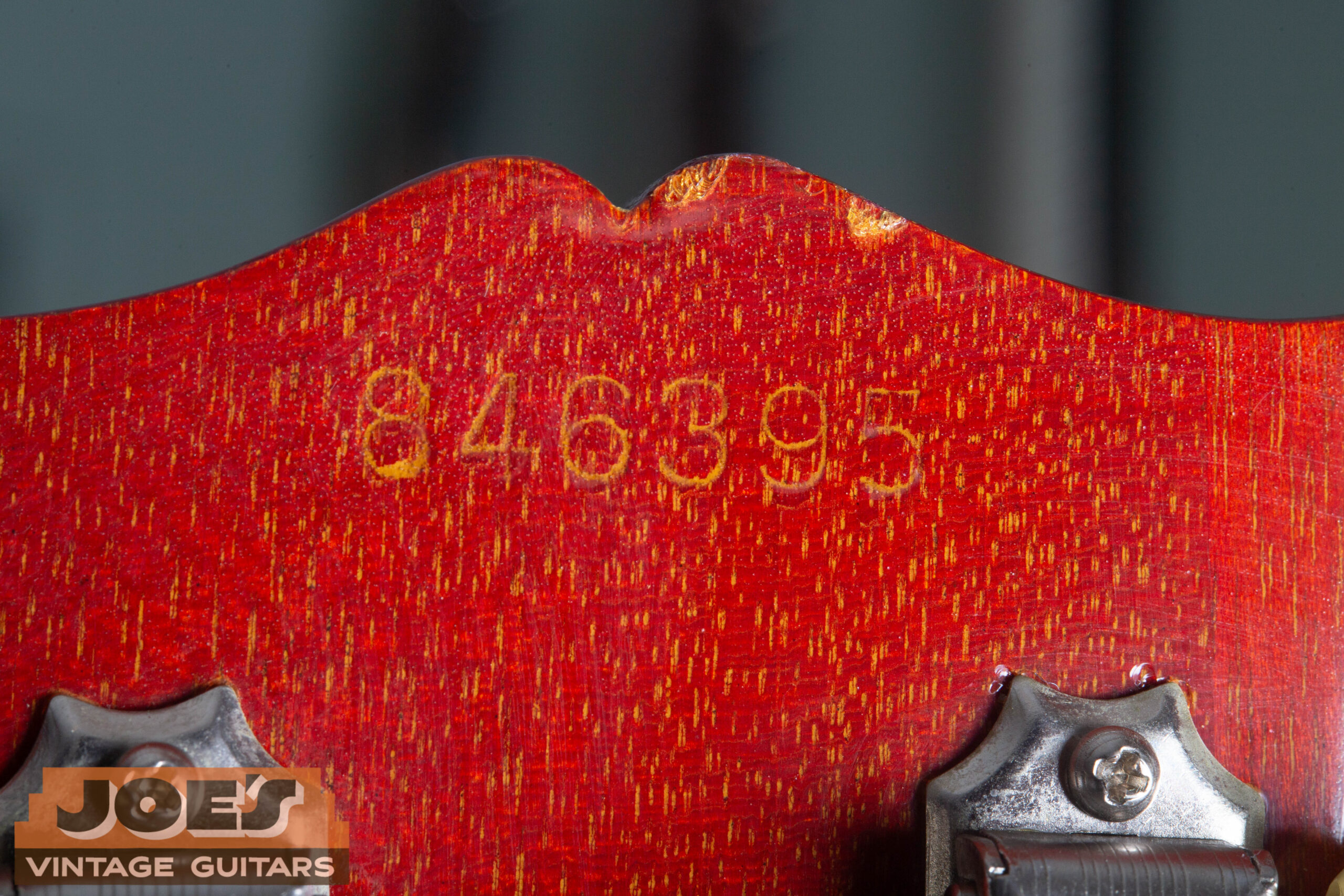 1966 Gibson ES-335 serial number ink stamp on back of headstock — 6-digit number showing period-correct fading and aging on cherry lacquer