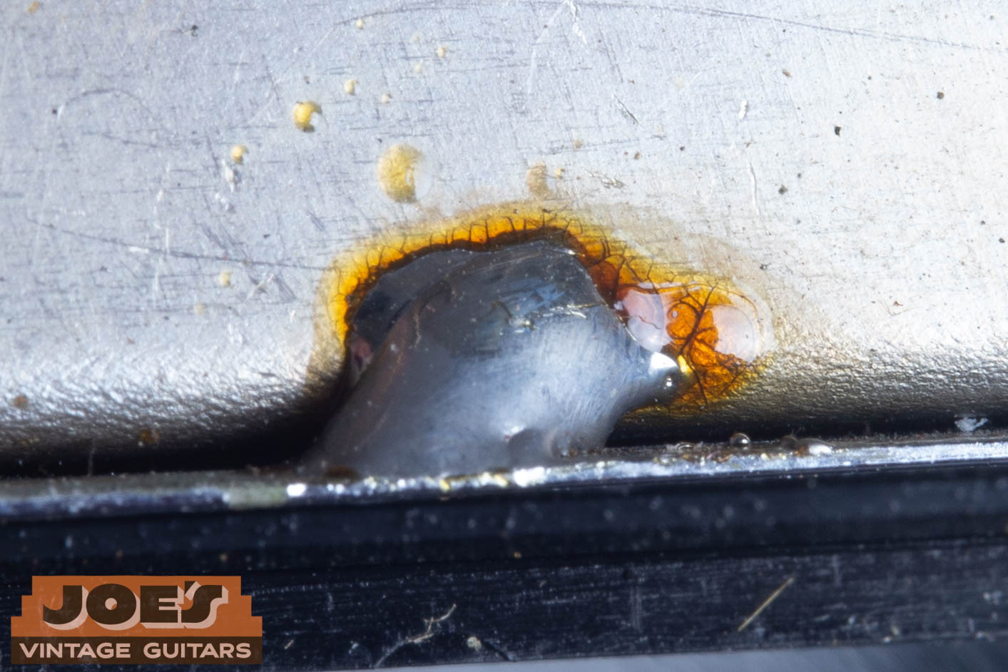 1966 Gibson ES-335 pickup cover undisturbed solder close-up — original factory solder joints on pickup cover confirming cover has never been removed