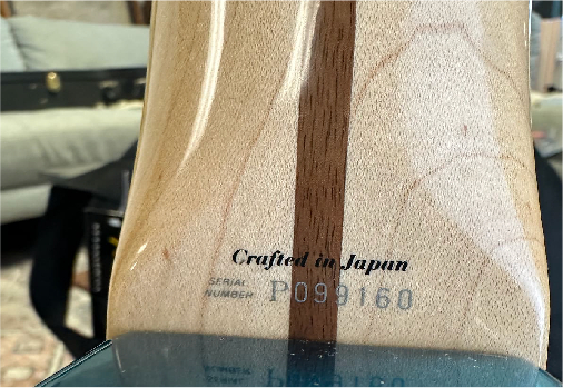 Crafted in Japan label on Fender guitar