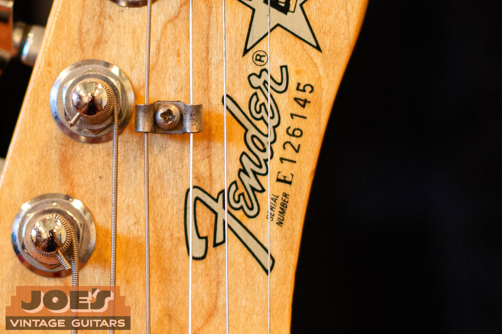 Fender E-prefix serial number on front of headstock — E indicates 1980s production, second digit gives the specific year