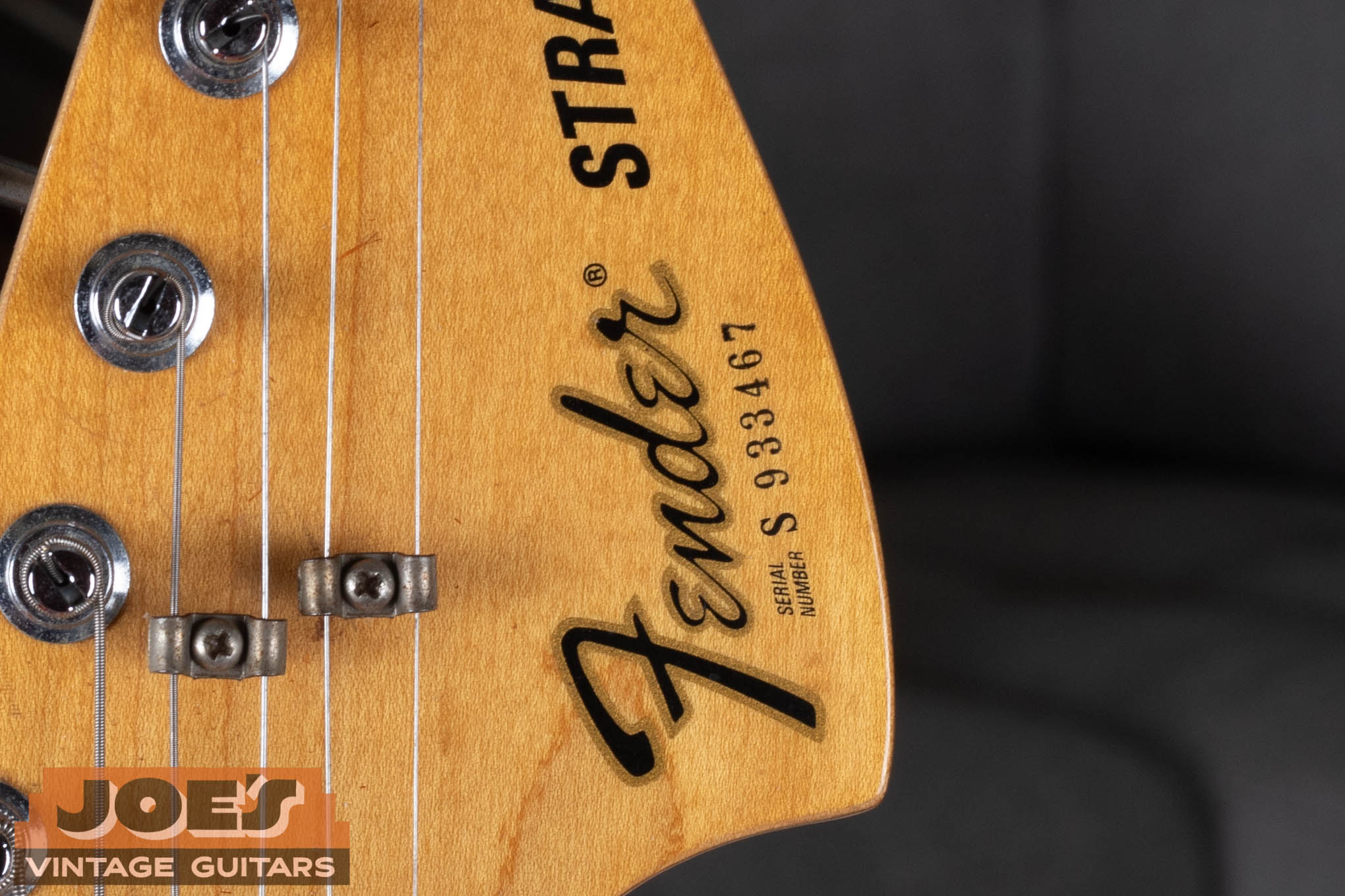 Fender guitar front of headstock serial number ink stamped below the Fender logo, 1976–1995