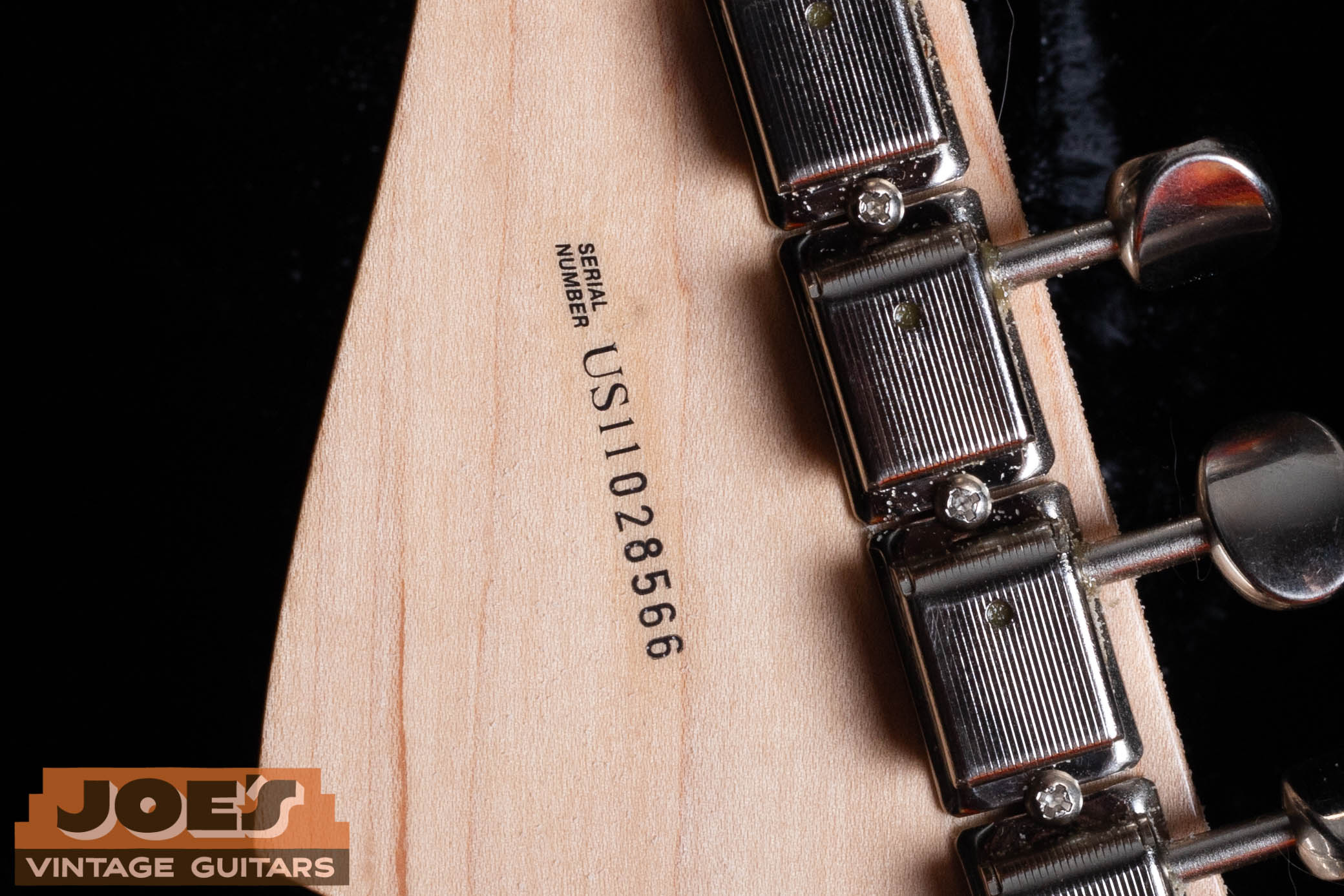 Fender US-prefix serial number on back of headstock — US indicates 2010s and later production, first two digits after US give the specific year