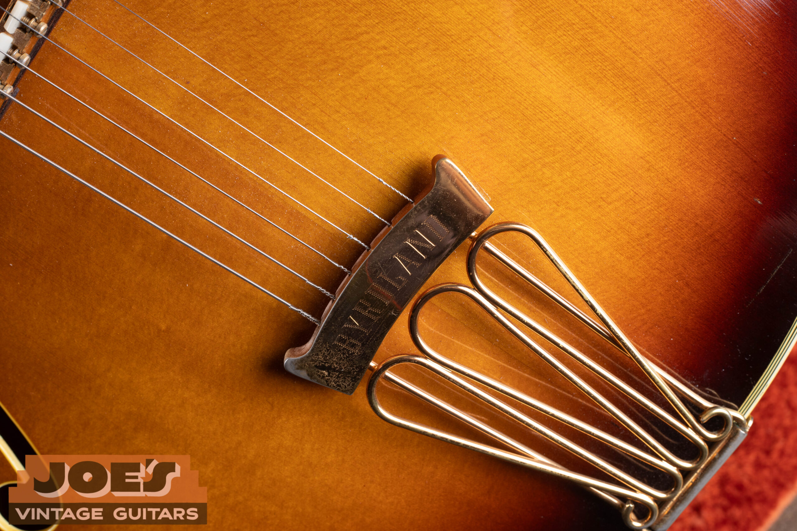 1967 Gibson Byrdland engraved tailpiece — three-loop trapeze style with Byrdland name engraved on crossbar, gold plated