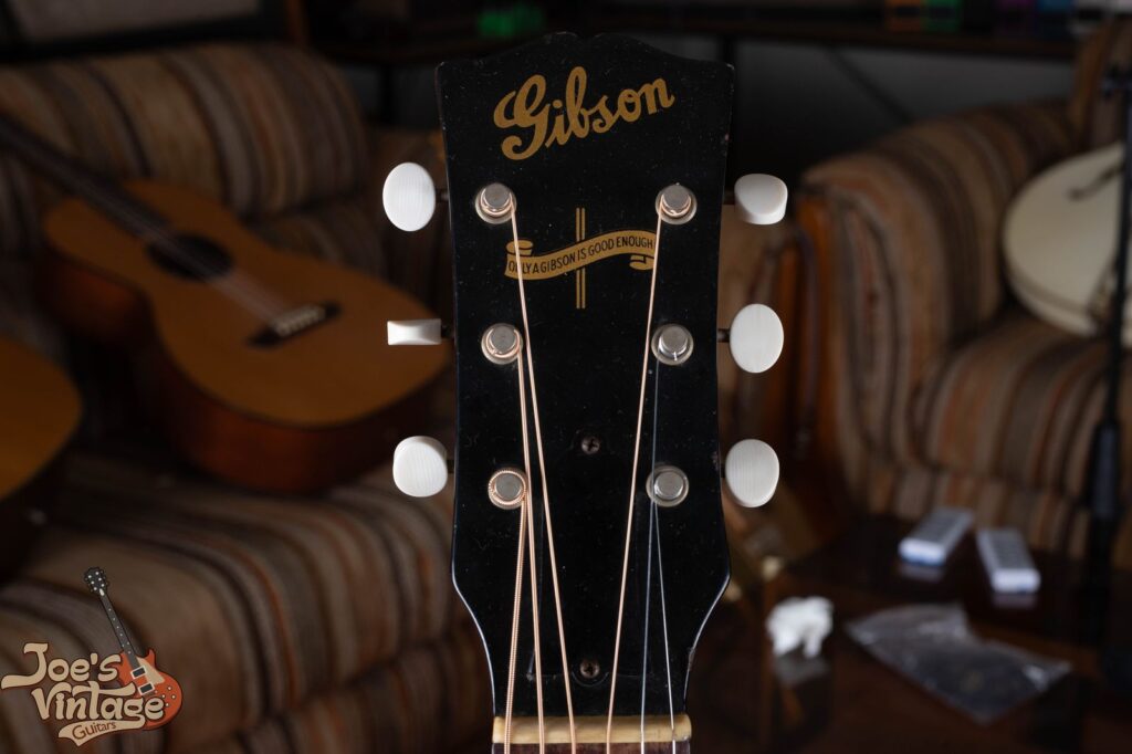 Vintage Gibson wartime headstock showing the Banner logo reading Only a Gibson is Good Enough — identifier of guitars made between 1942 and 1945