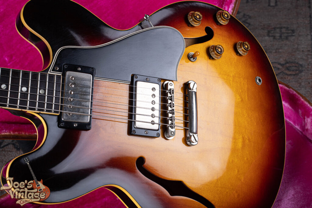 Close-up of original nitrocellulose lacquer finish on a 1959 Gibson ES-335 sunburst guitar showing exceptional gloss and minimal checking.