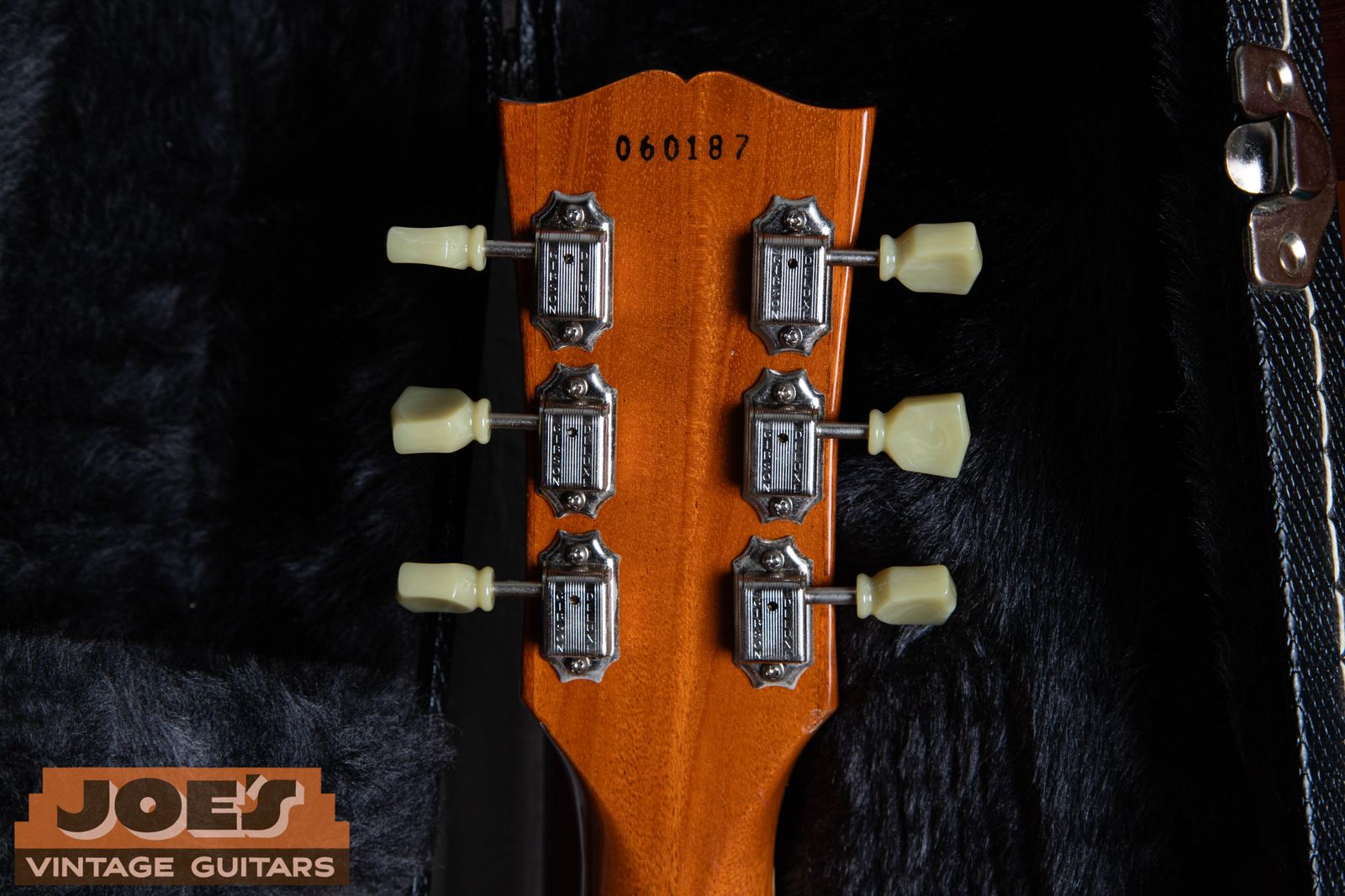 Ink stamped serial number on the back of the headstock of a Gibson Les Paul Classic — a reissue-style stamp that differs from the authentic vintage 1950s ink stamp font