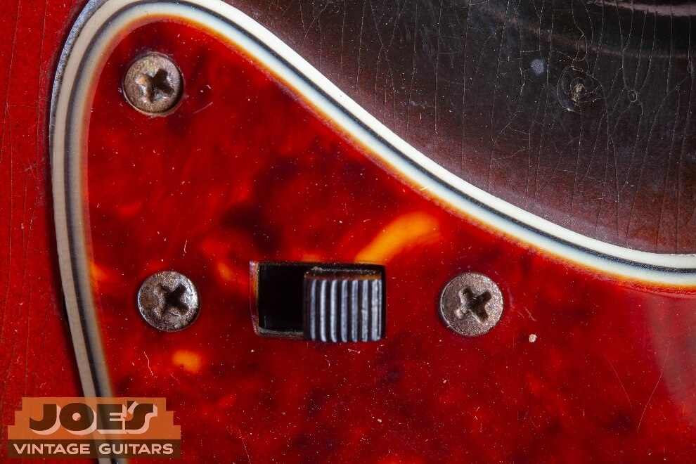 Vintage Fender guitar screw wear and consistent patina on authentic example