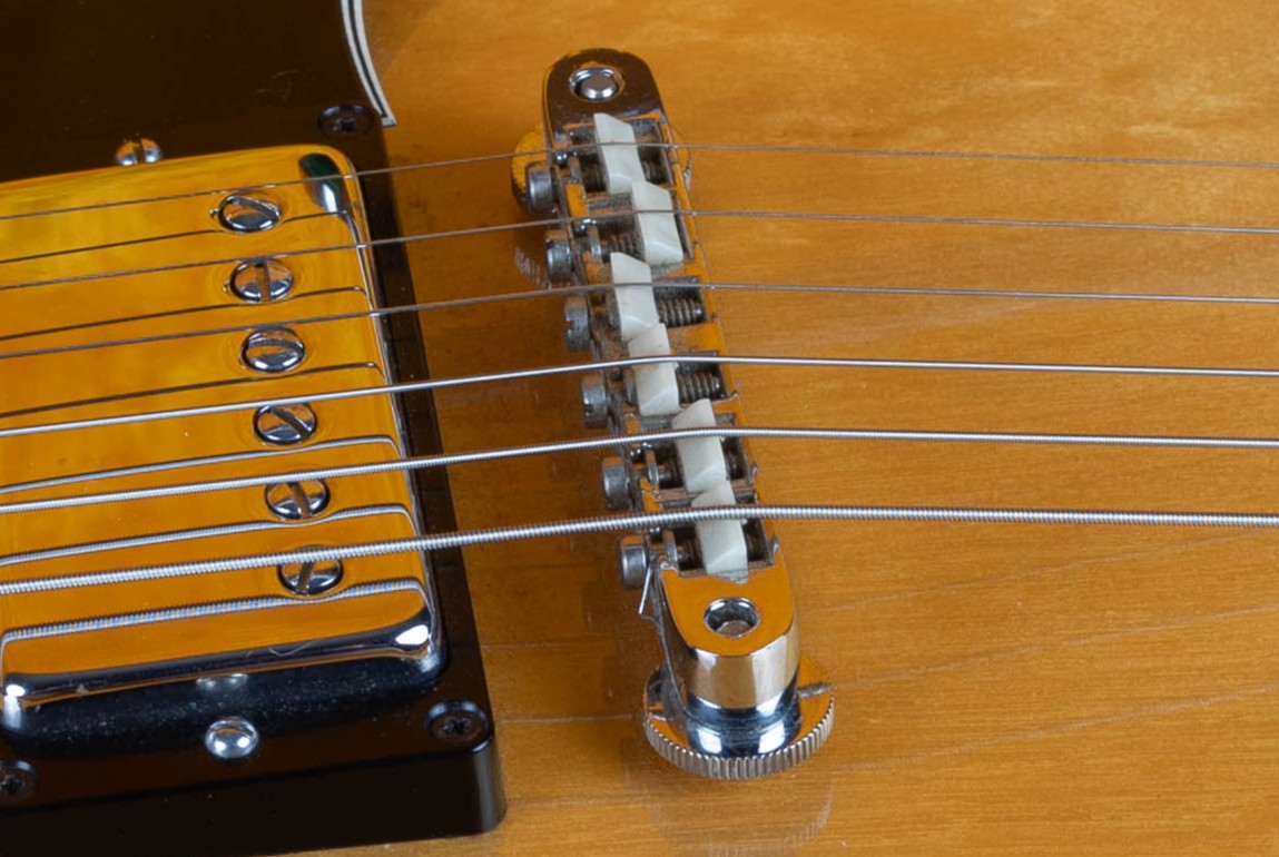 Wired ABR-1 bridge on a vintage Gibson — the retaining wire added to the saddles from mid to late 1962 through 1974