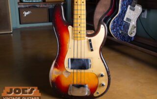 A 1959 Fender gold guard precision bass in Sunburst finish.