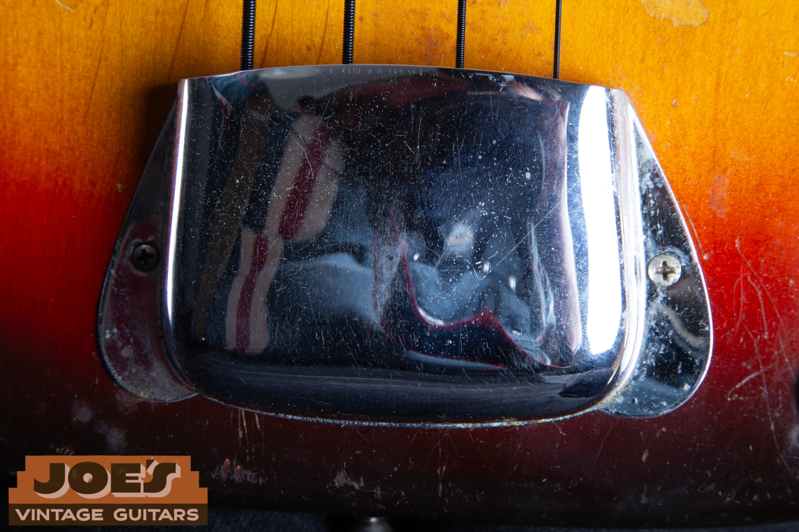 Chrome ashtray bridge cover installed on a 1959 Fender Precision Bass