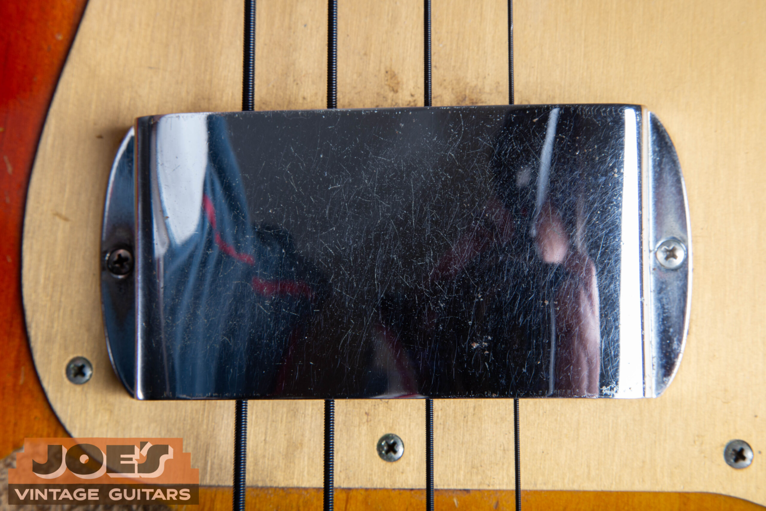 Chrome ashtray pickup cover on a 1959 Fender Precision Bass