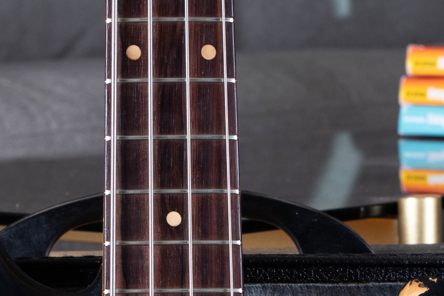 Late 1959 rosewood slab fretboard with clay dot inlays on a Fender Precision Bass, marking the end of the maple-neck gold-guard era