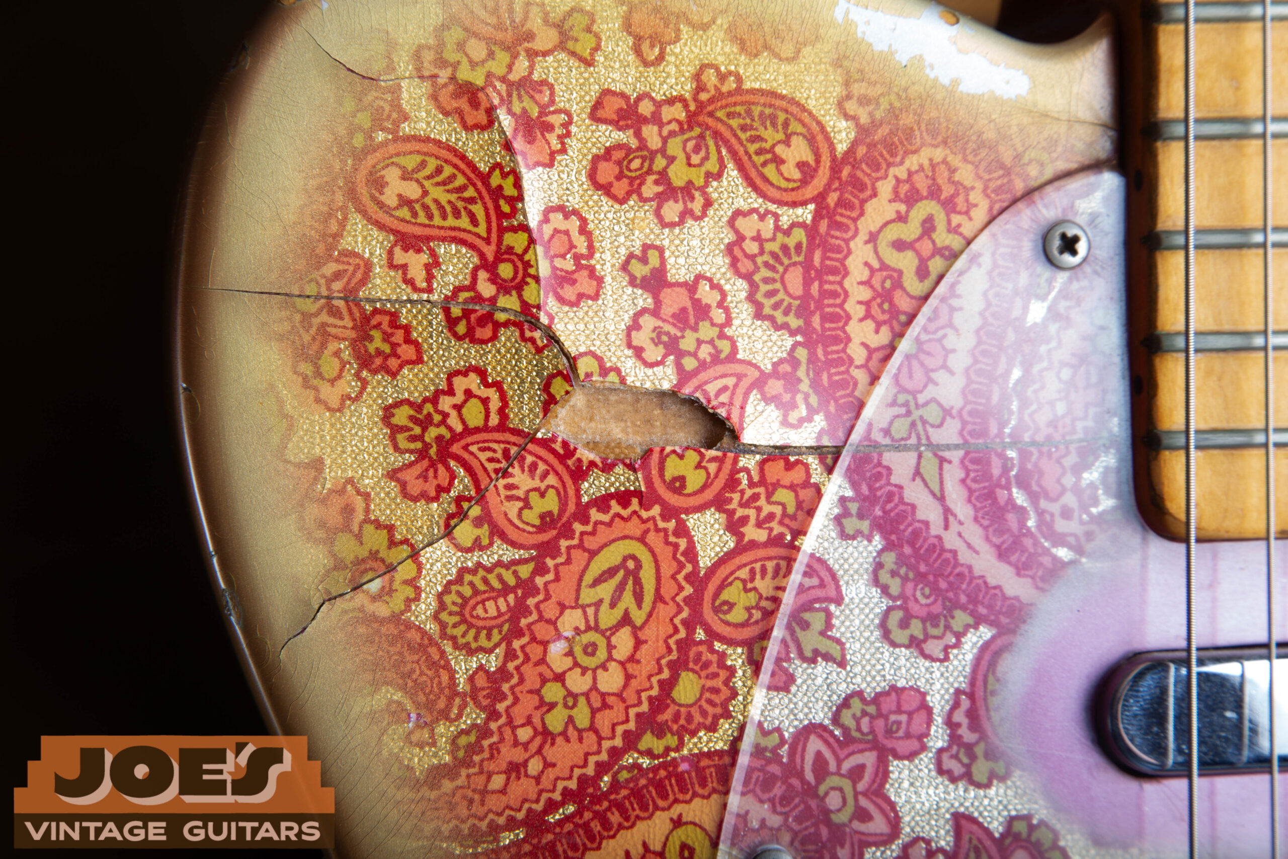 Missing chunk of Cling-Foil paper on a 1969 Fender Paisley Telecaster — typical wear pattern showing foil delamination and loss