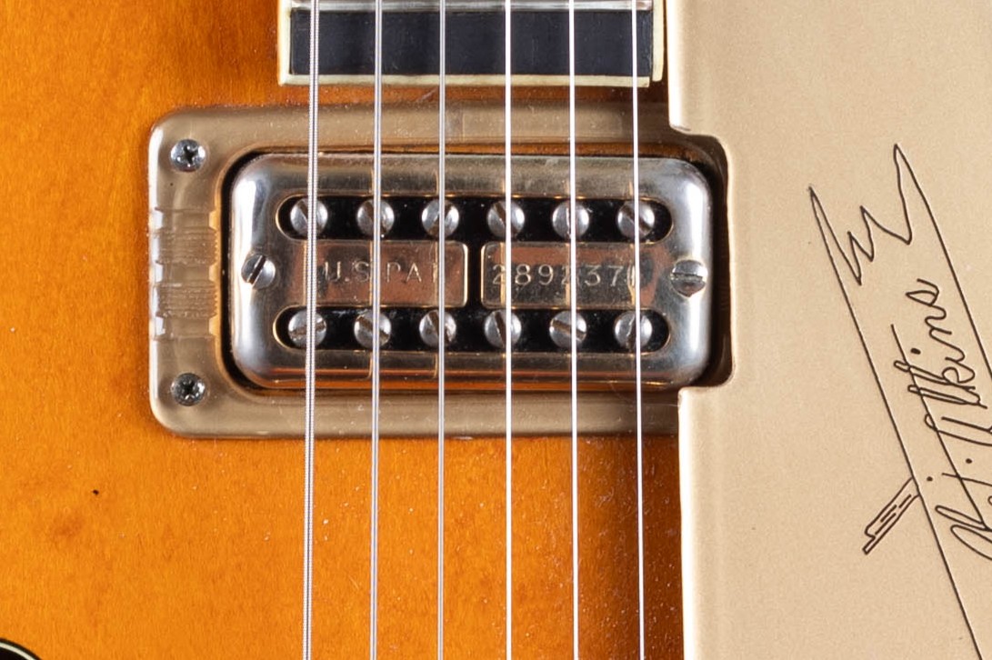 Gretsch Filter'Tron humbucker pickup — showing the dual-coil cover with two rows of threaded pole pieces, the defining visual of the golden-era Gretsch sound from 1958 onward