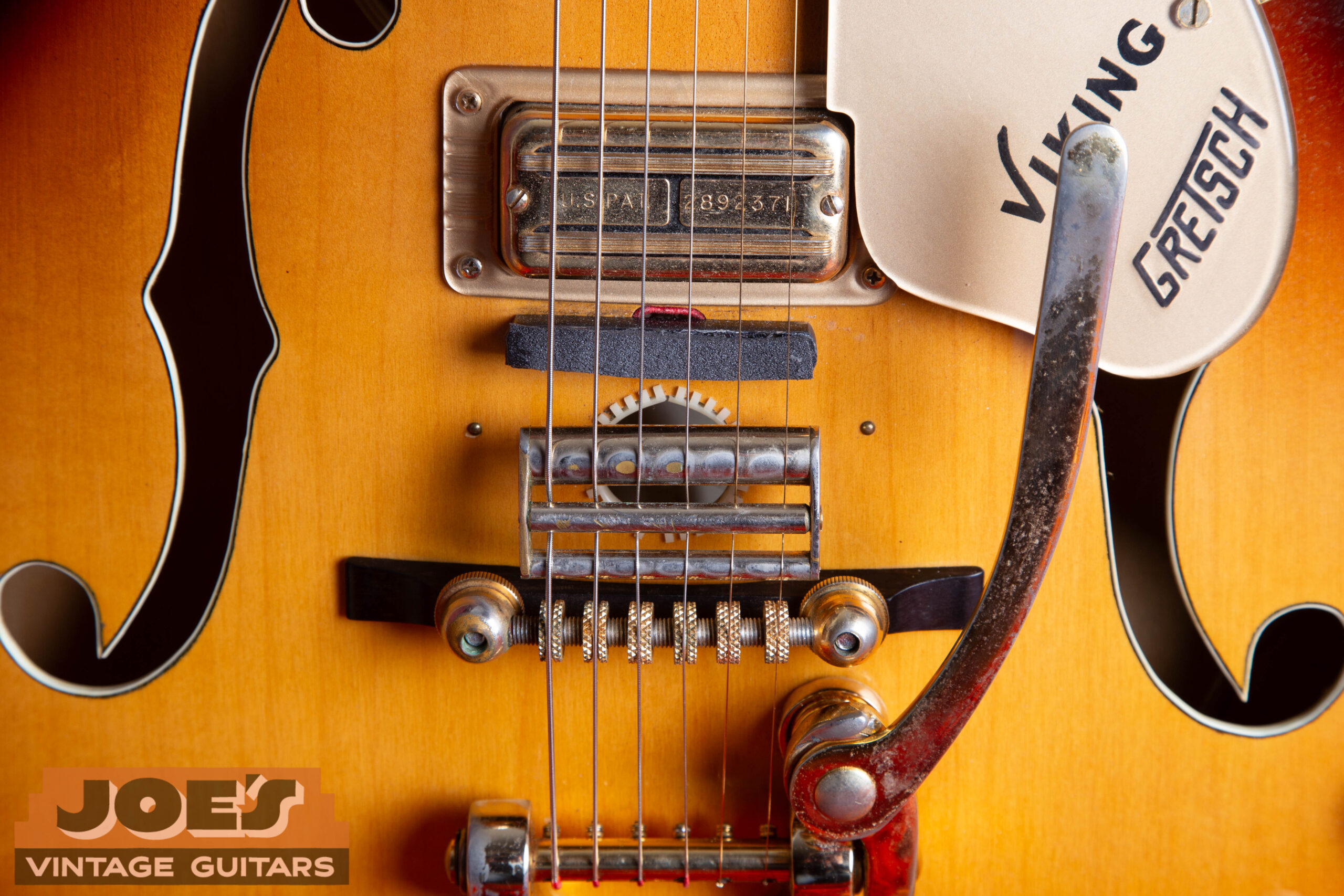 Gretsch Super'Tron pickup showing wide blade pole pieces — the bar or blade design distinguishes the Super'Tron from the standard Filter'Tron and dates the guitar to 1964 or later