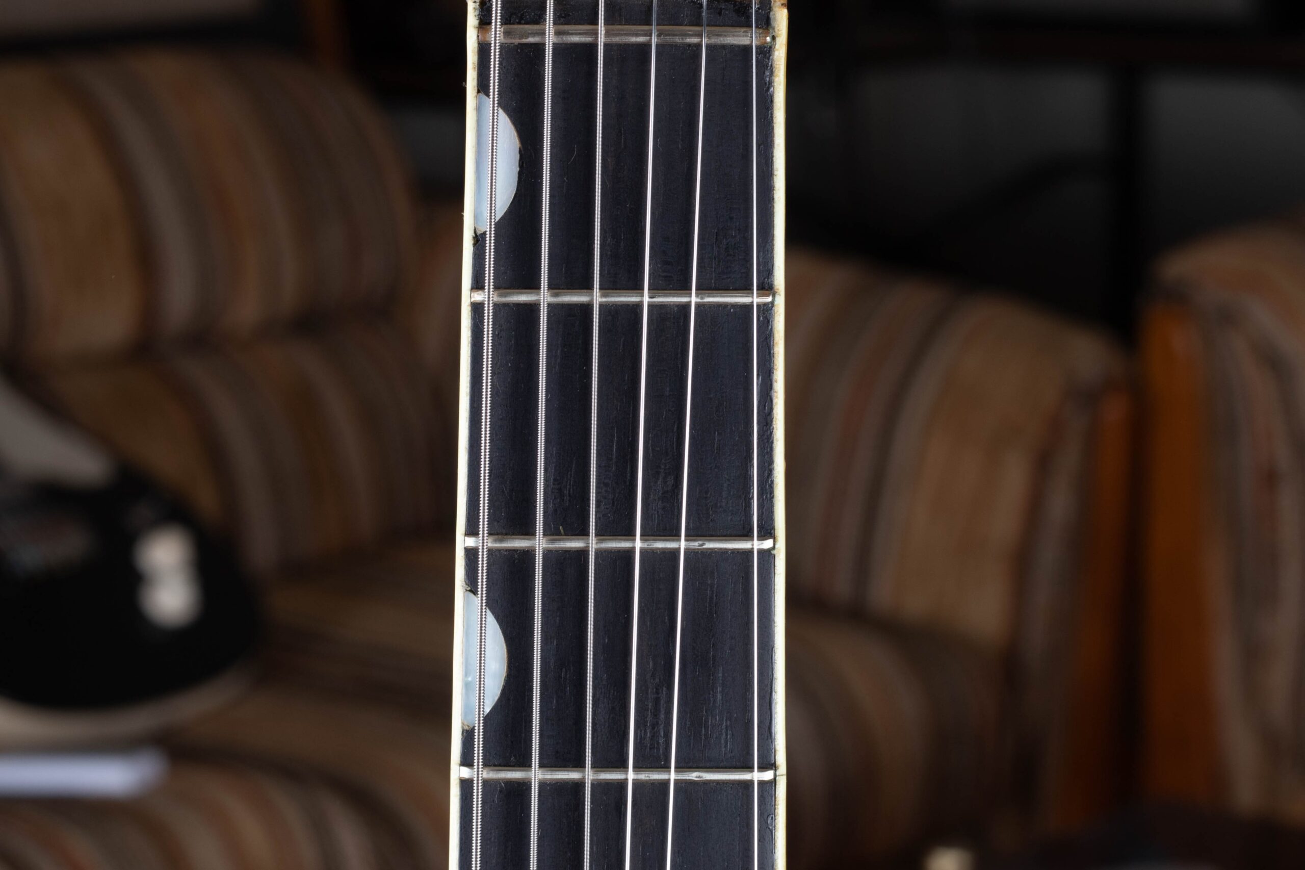 Gretsch Neo-Classic thumbprint fingerboard inlays on a golden-era hollowbody — oval shaped inlays positioned on the bass side edge of the fingerboard, standard from 1958 through the mid-1960s